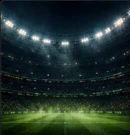 Stadium floodlights over an empty pitch